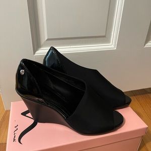 CK patent heel and satin-like fabric in front wedge heels.  Size 5